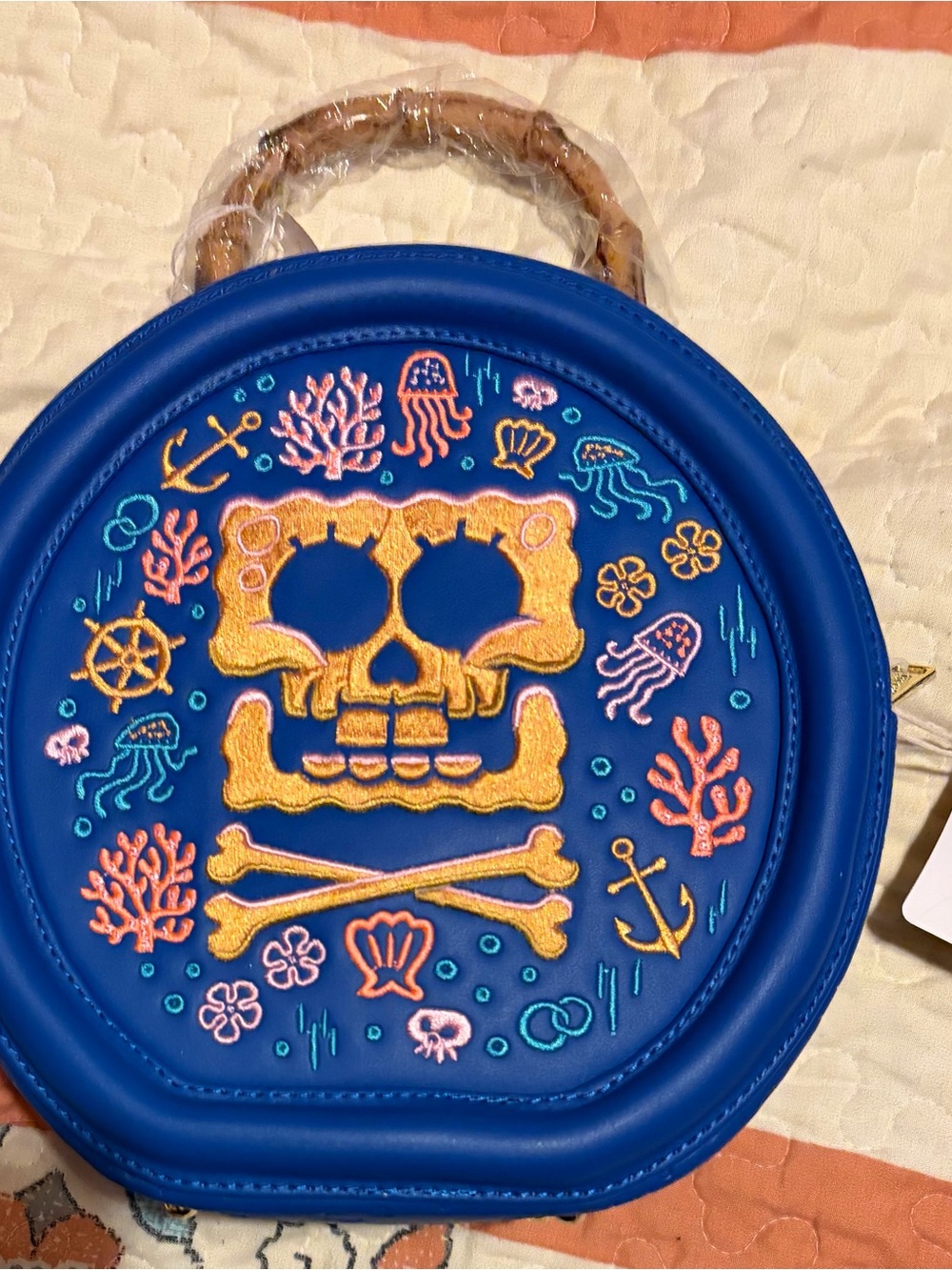 Loungefly Blue Round Crossbody Bag with Yellow SpongeBob Embroidered Skull